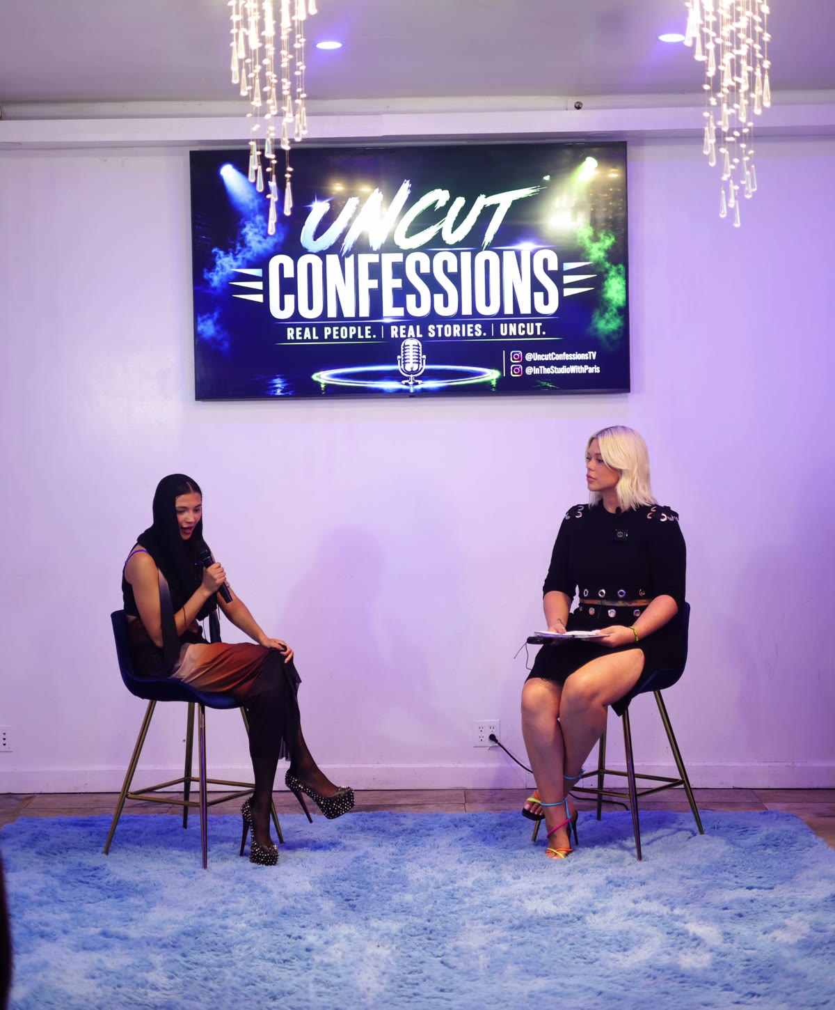 Ava Eris on the Uncut Confessions stage with host Paris Banks